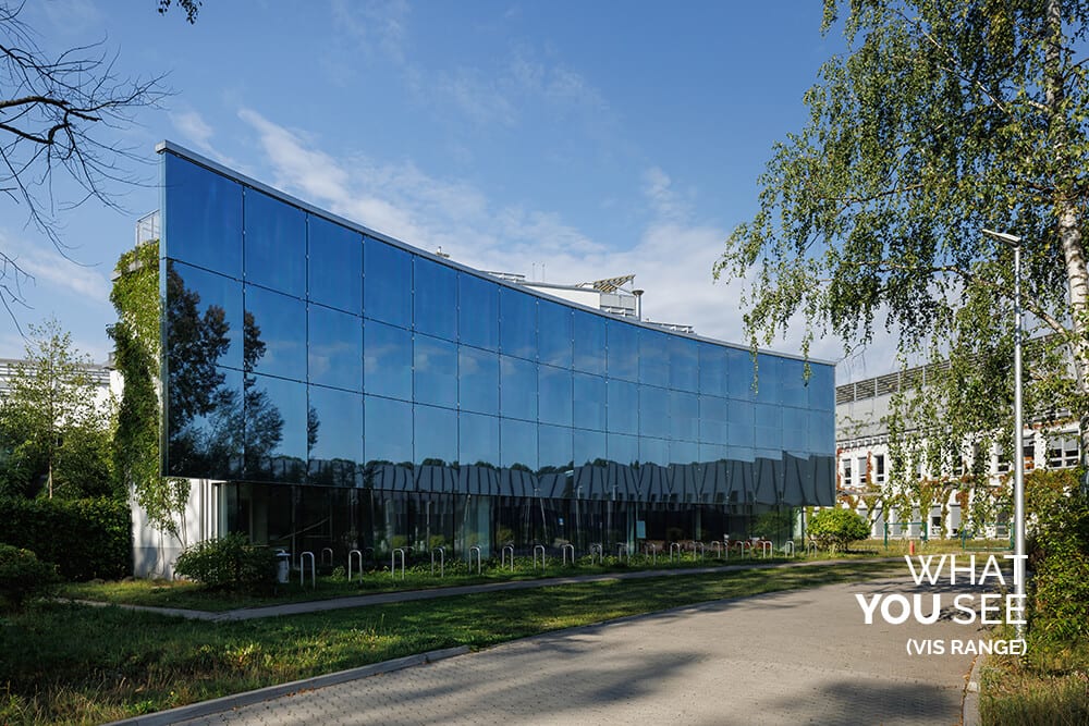A glass building with bird-safe film installed, appearing completely clear