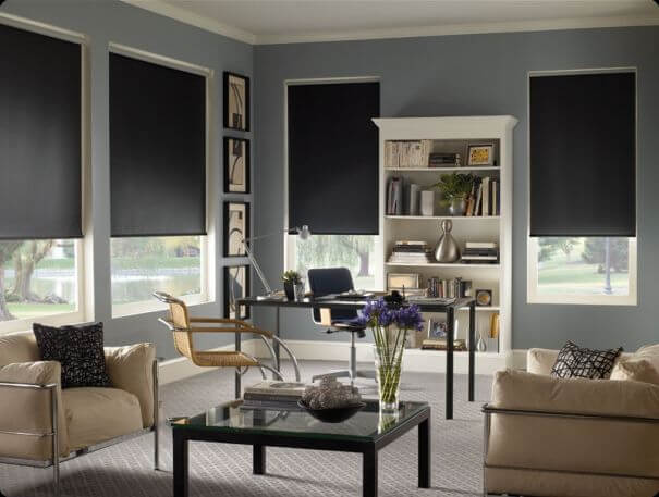 Roller shade mounted over a glass door