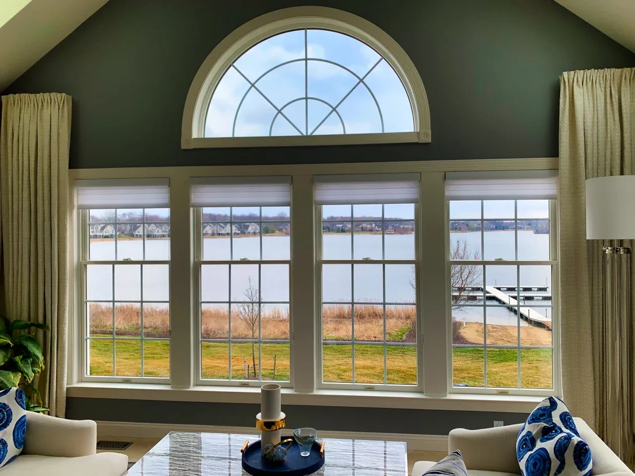 Arched grid window with heat-control film