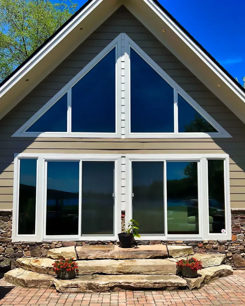 A-frame gable window with dark heat-control film