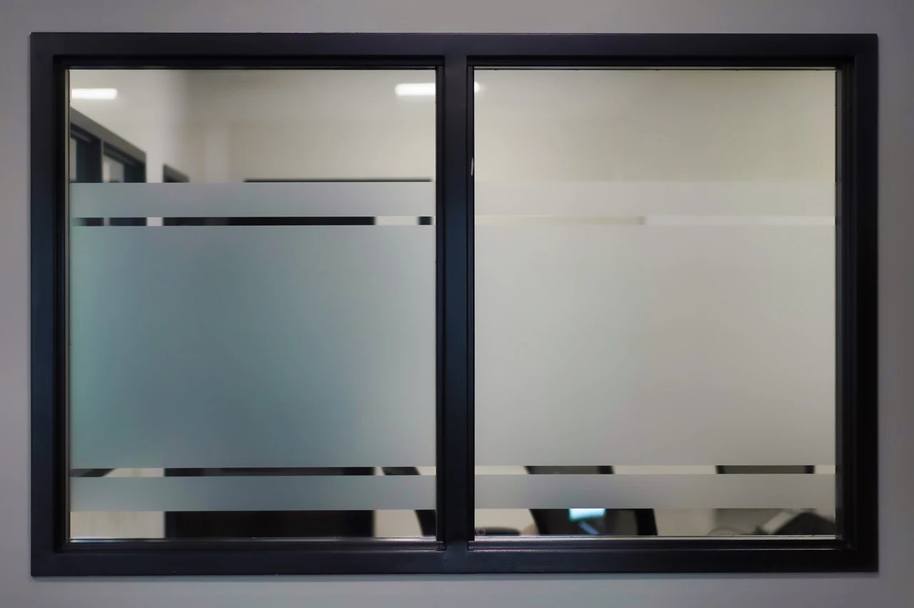 Sliding door with a frosted privacy band