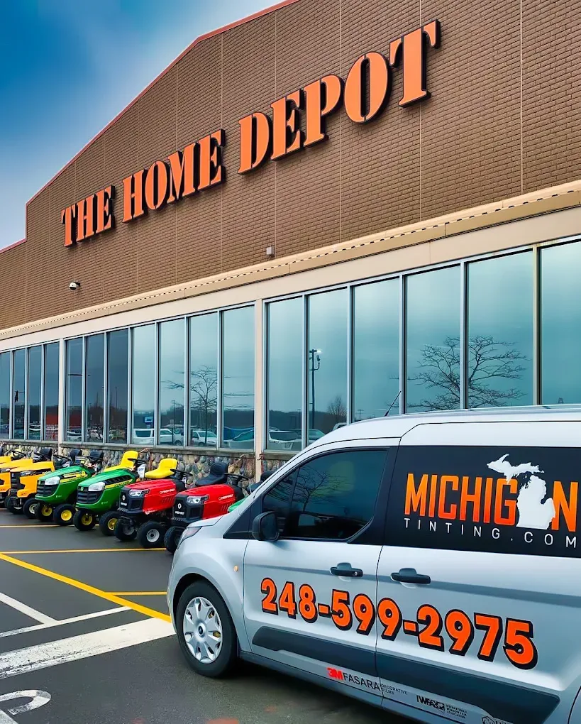 The company van outside a Home Depot storefront job