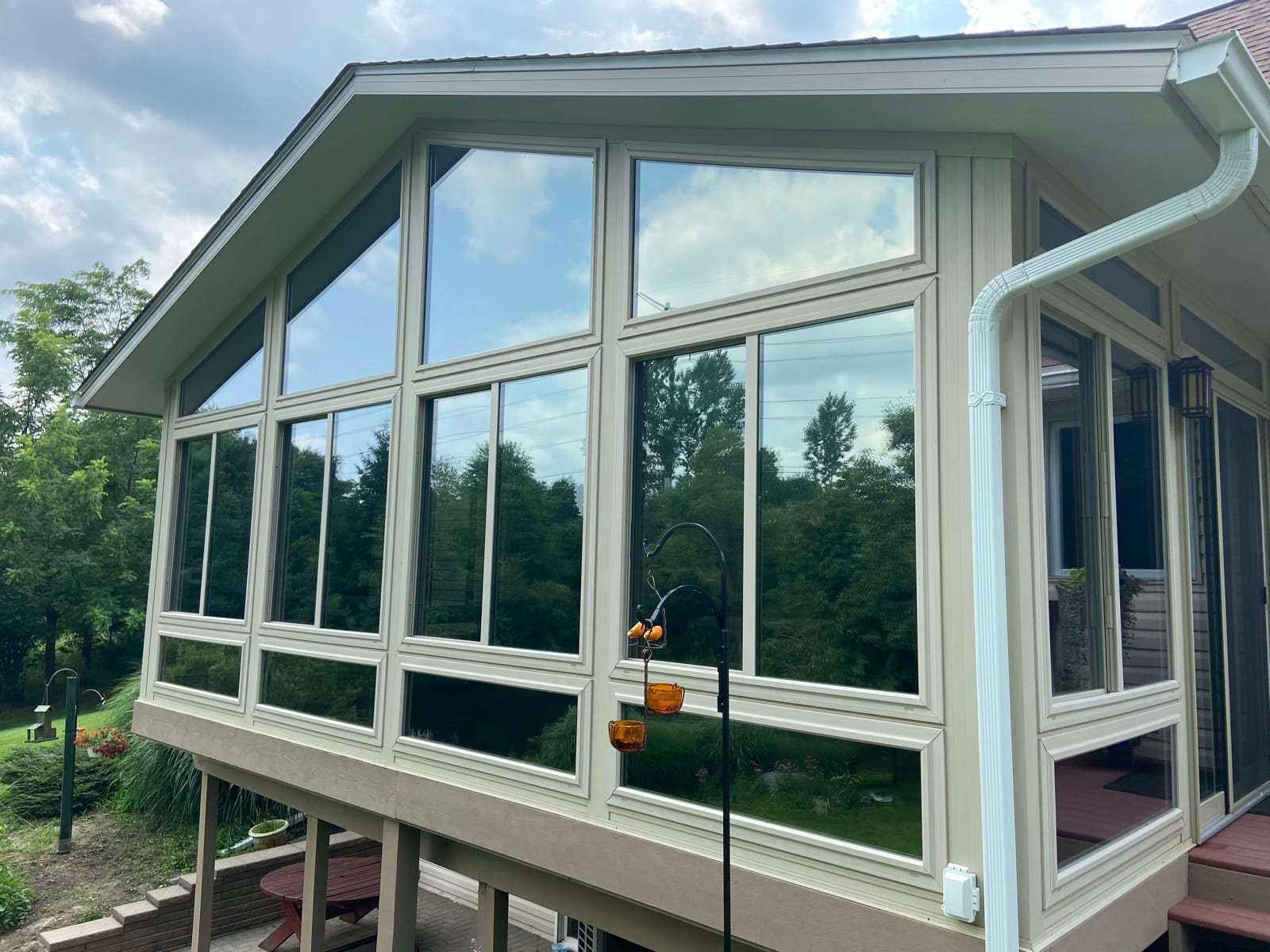 Sunroom exterior with tinted glass walls